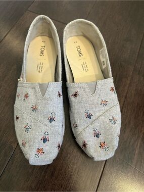 TOMS Light Blue Slip-Ons with Bee Embroidery